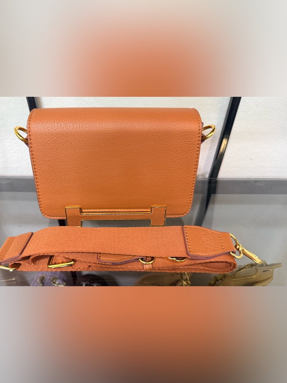 Structured Orange Crossbody Bag with Gold Accents